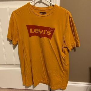 Women’s Levi’s yellow and red t shirt size medium